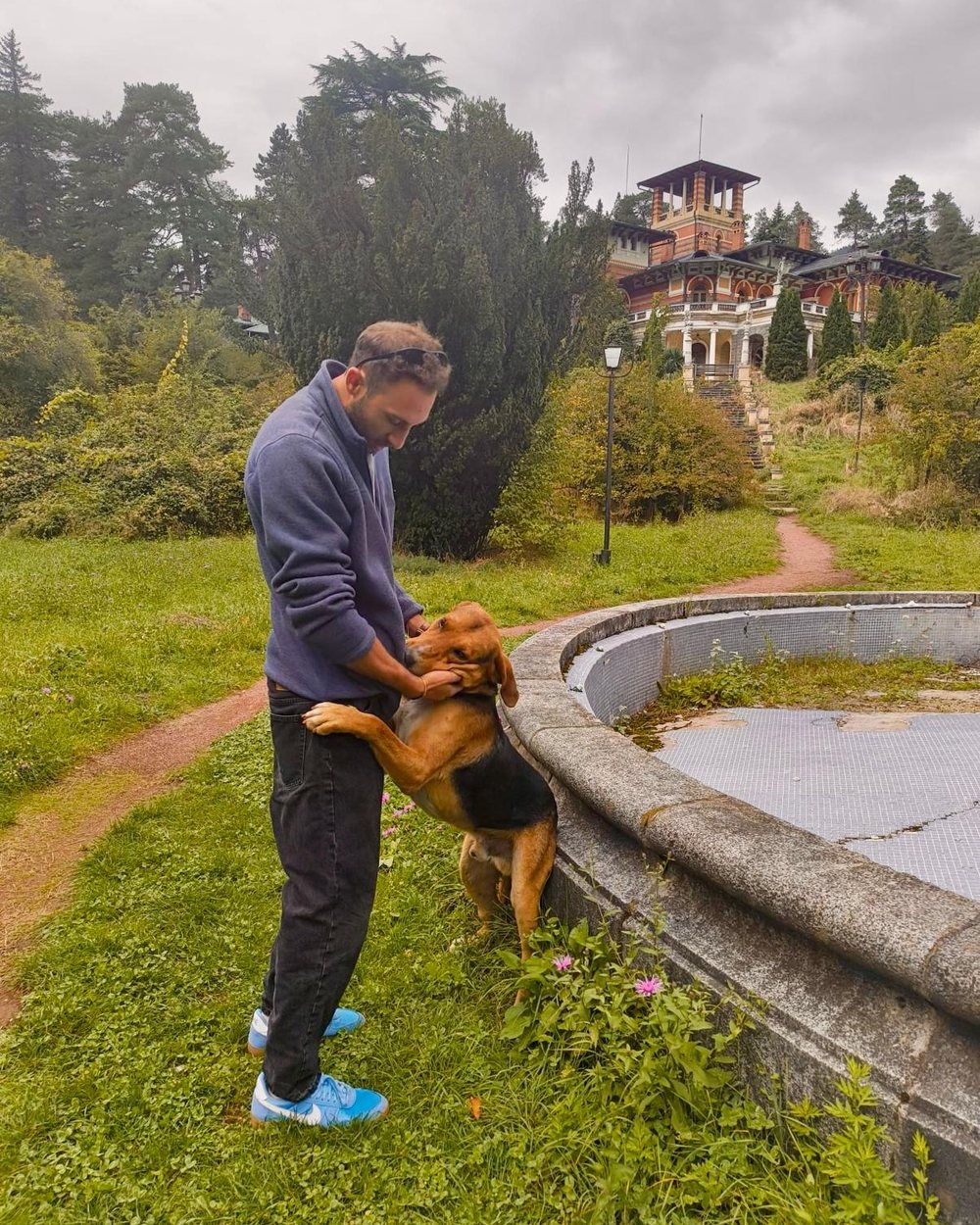 Dror Arusi outdoors, with a dog